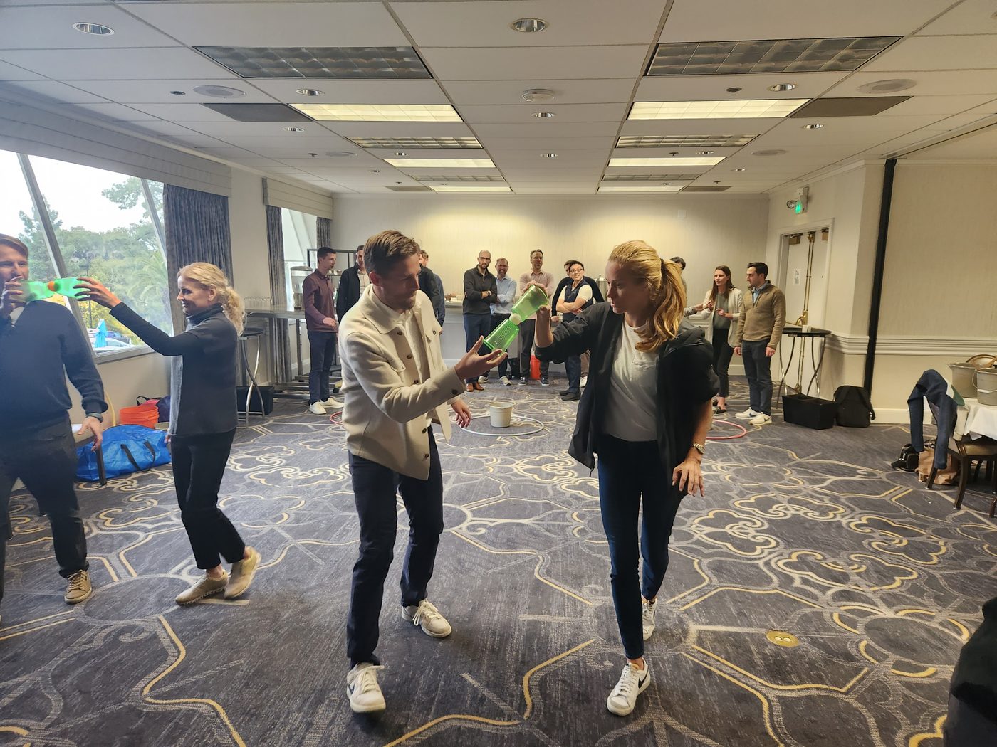 Participants balancing and moving together during a team challenge