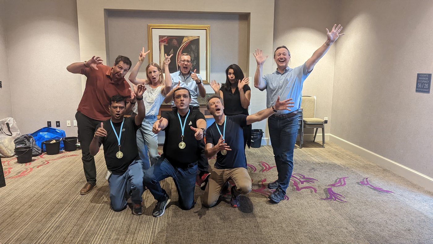 A team posing with medals after the challenges