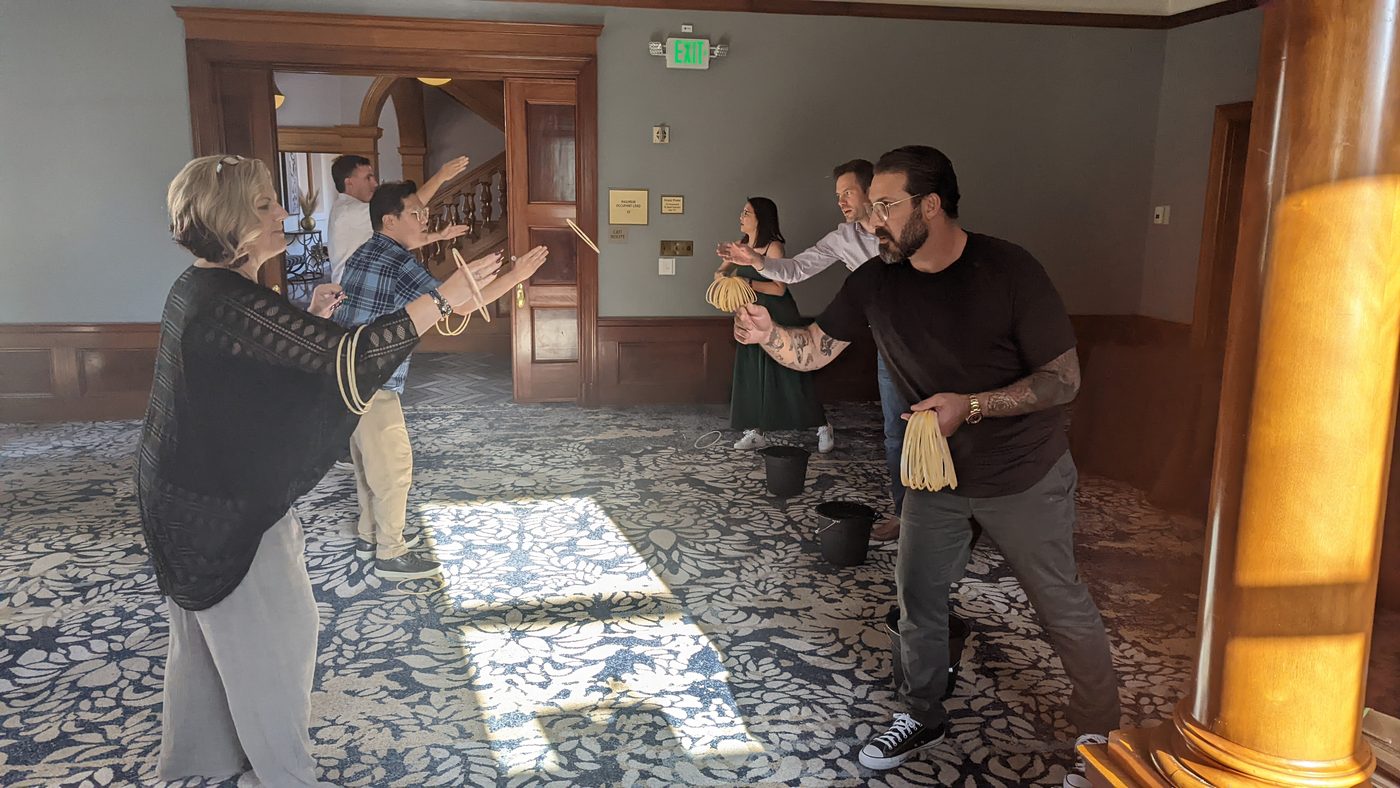 A group working together on a room-scale challenge