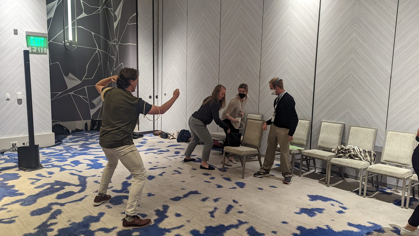Participants moving through a team challenge